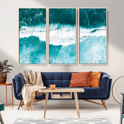 Aerial view of turquoise ocean waves crashing with white foam, perfect for tropical coastal or modern beach-style home decor.