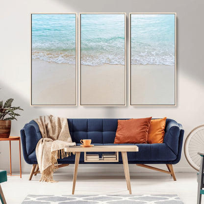 Soft shoreline with gentle aqua waves on smooth sand, ideal for minimalist coastal or pastel ocean-inspired home wall decor.