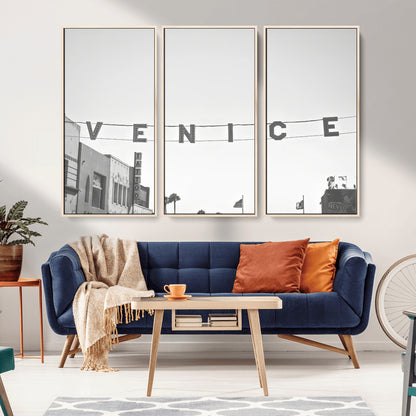 Black and white photo of Venice Beach sign and palm-lined street, perfect for urban coastal or minimalist LA-inspired wall decoration.