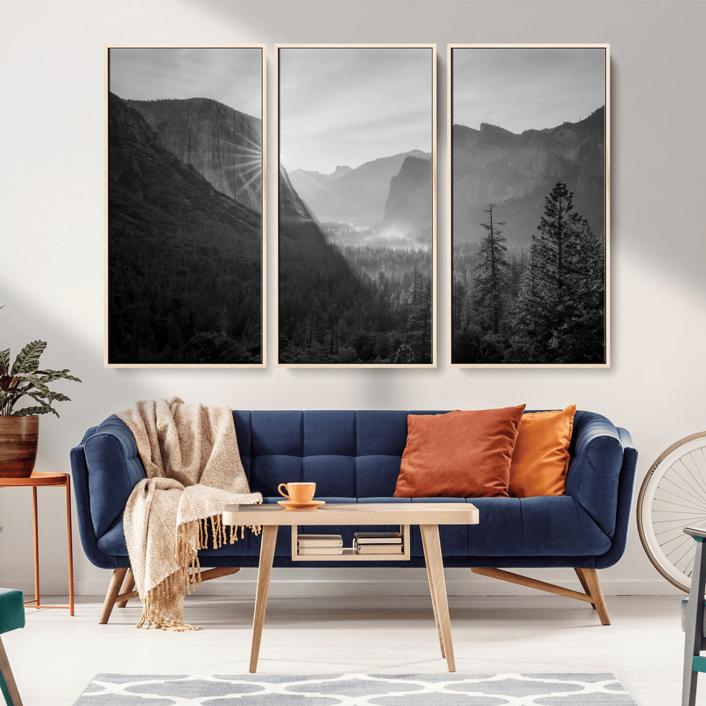 Black and white landscape of Yosemite with sun rays peeking over El Capitan, ideal for moody nature or modern rustic decor.