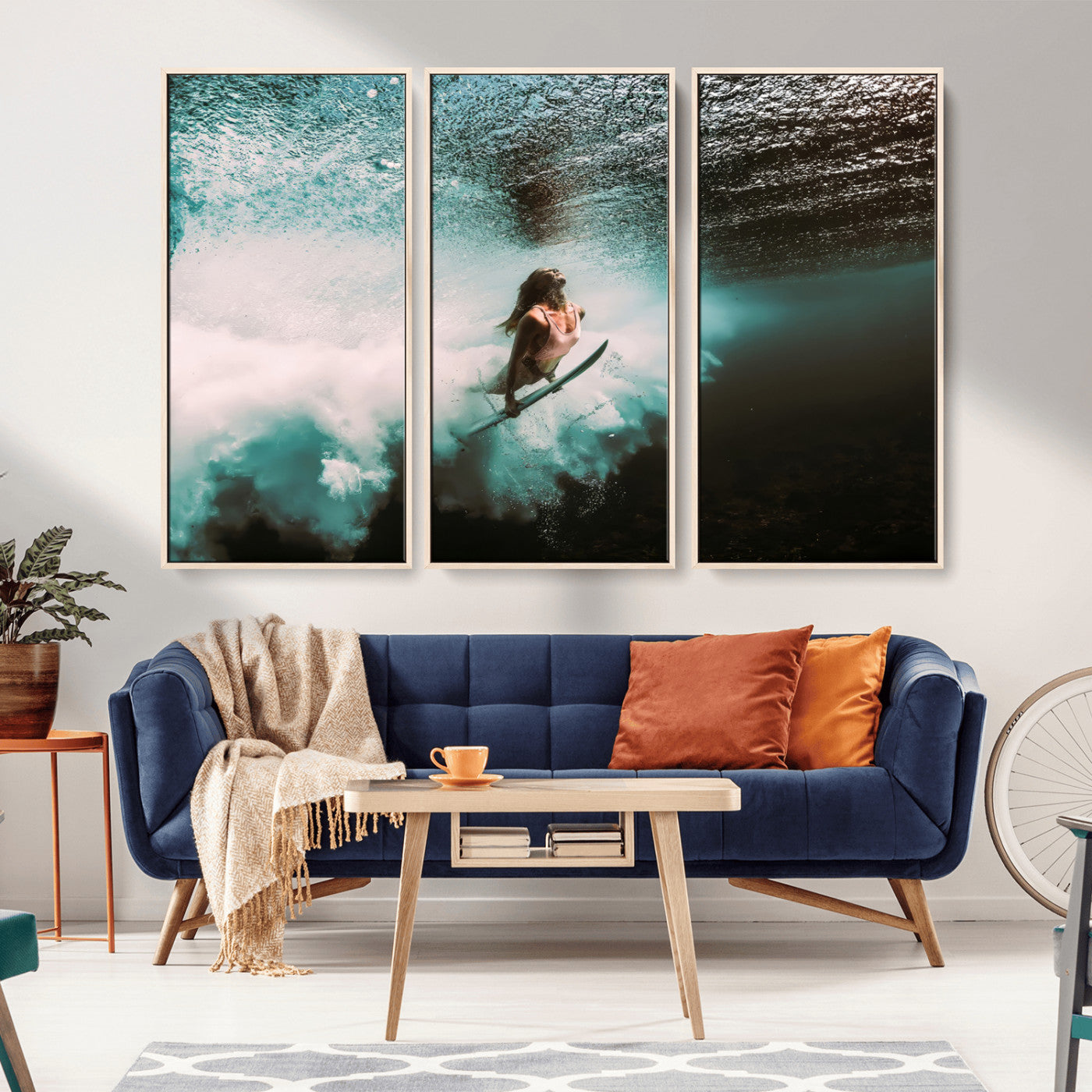 Vibrant underwater photo of a female surfer diving through turquoise waves, perfect for coastal boho or surf-inspired home decor.