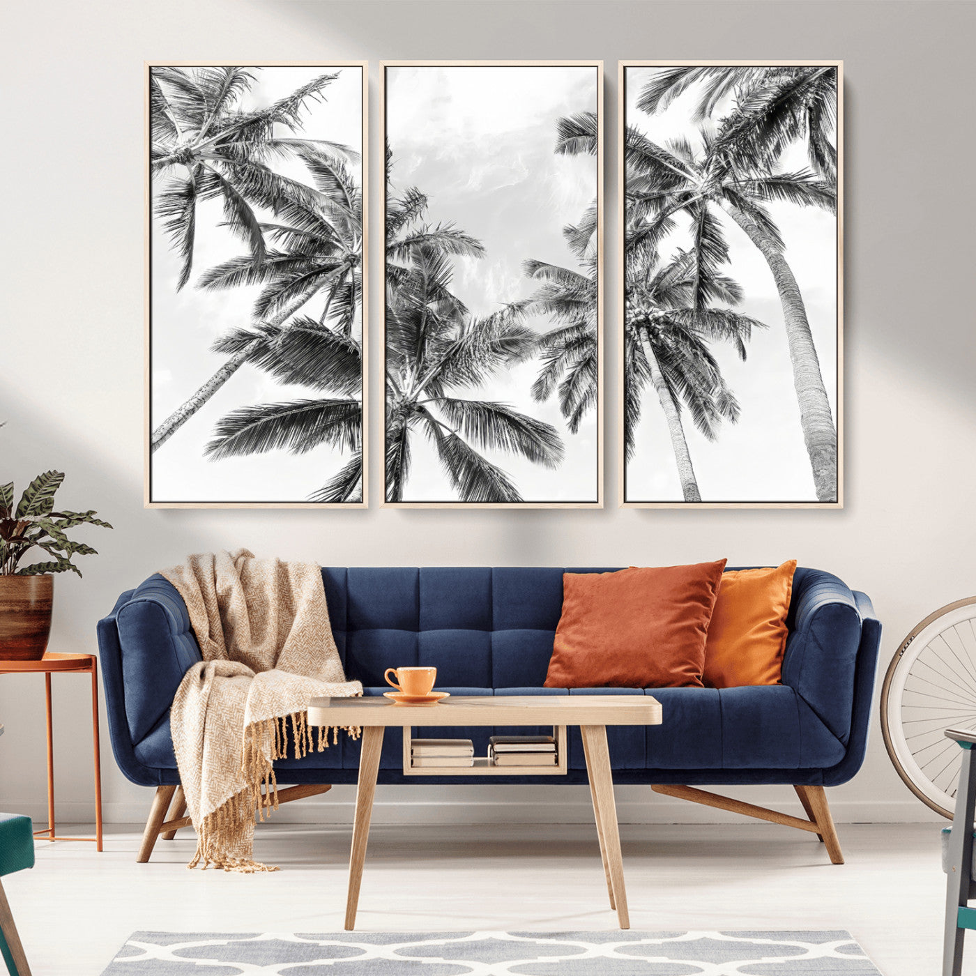 Black and white tropical palm trees viewed from below, swaying gently against a bright sky, creating a serene and elegant coastal atmosphere.