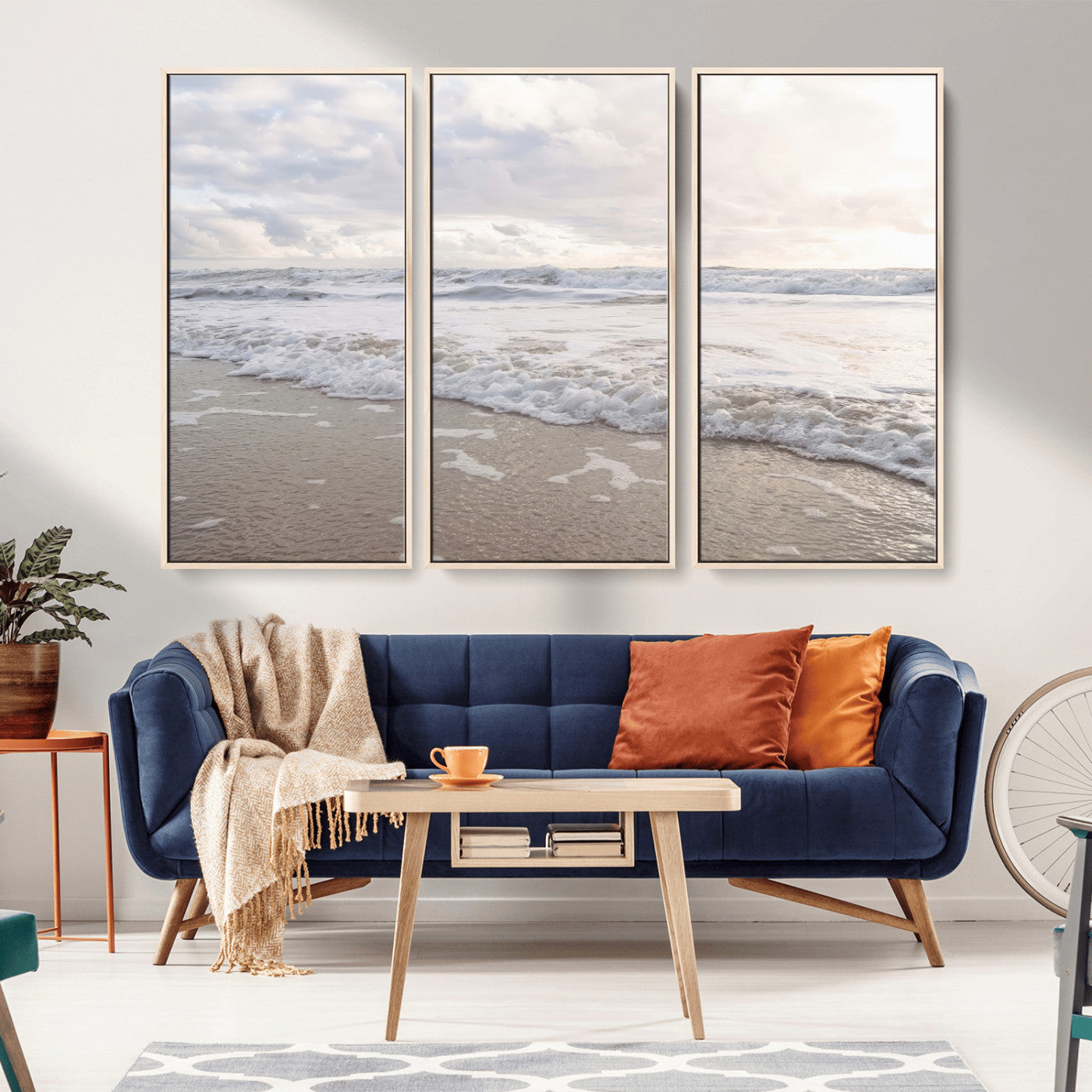 Peaceful ocean waves rolling onto the sandy shore under soft light, perfect for neutral or coastal minimalist decor themes.