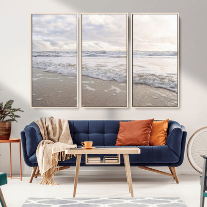 Peaceful ocean waves rolling onto the sandy shore under soft light, perfect for neutral or coastal minimalist decor themes.