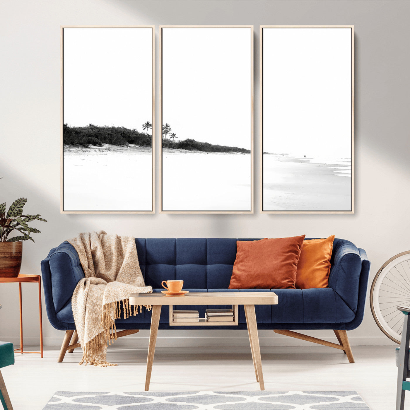 A black and white minimalist coastal scene with a vast open beach, distant palm trees, and a lone figure walking along the shoreline, evoking serenity and solitude.