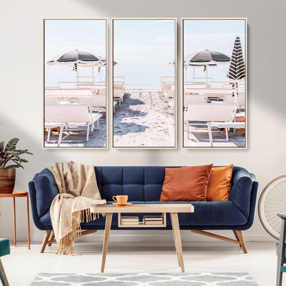 A serene minimalist beach scene featuring striped umbrellas, soft pastel sand, and an elegant lounge setup, creating a tranquil and stylish coastal retreat.