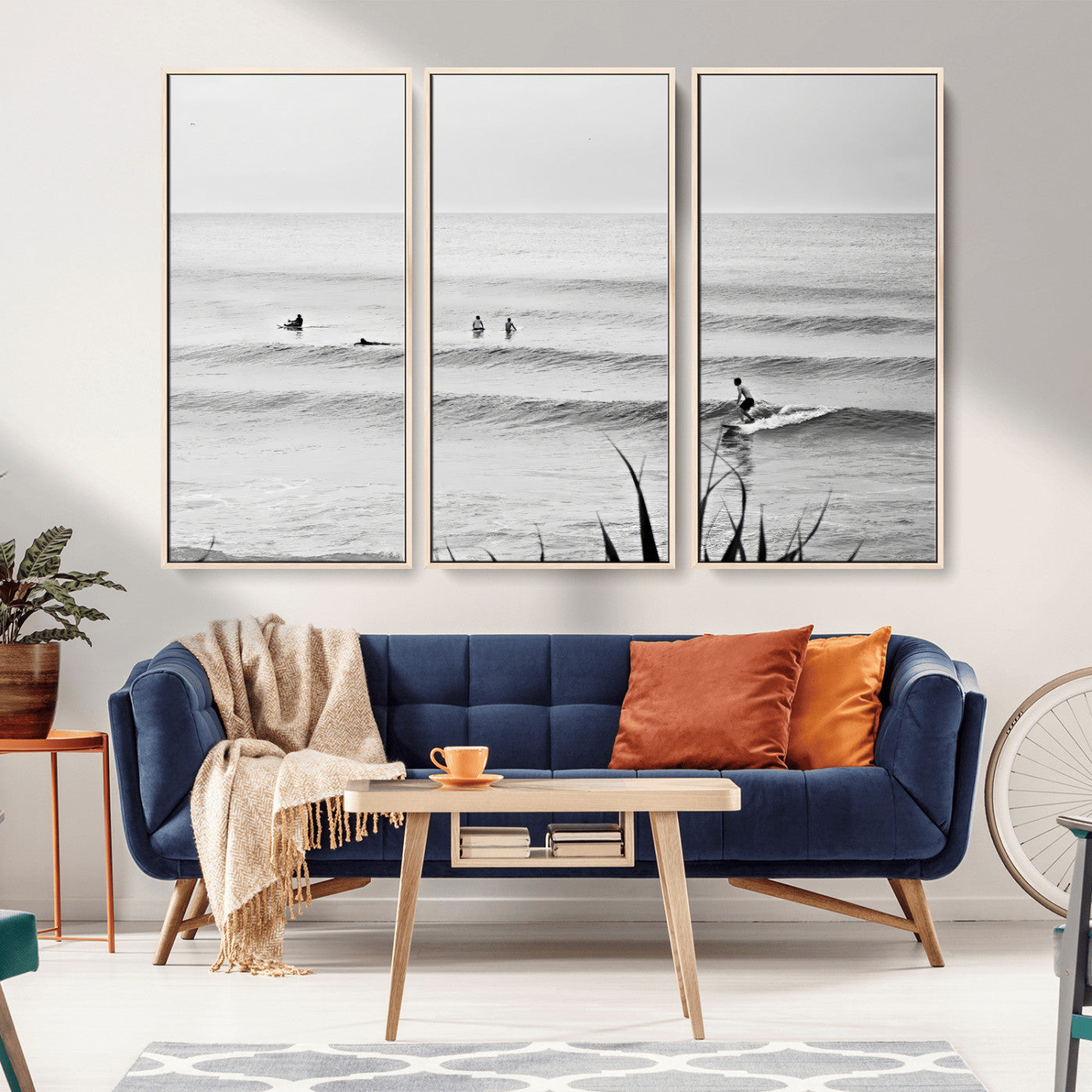 Monochrome canvas of surfers on calm ocean waves, ideal for minimalist coastal or beach-inspired interior decor.