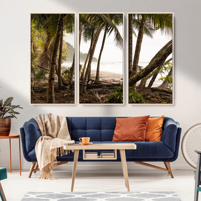 Dense tropical palm trees framing a sandy beach and ocean shore, ideal for jungle or coastal themed interior wall decor.
