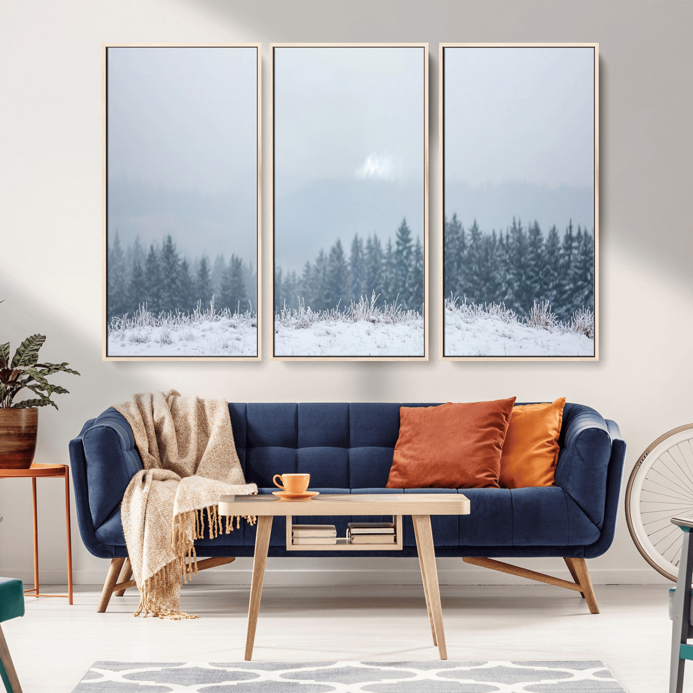 Snow-covered forest under misty sky, soft light breaking through clouds, ideal for minimalist or Nordic-inspired home decor.