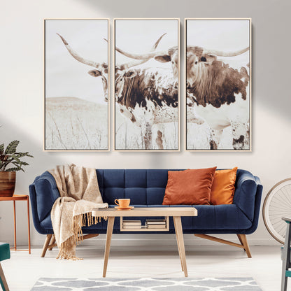 Two longhorn cows standing in a sepia-toned pasture with soft light, ideal for rustic or farmhouse-themed neutral wall decor.
