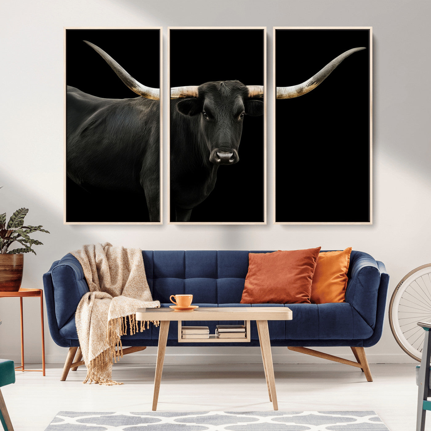 Close-up of a black Texas longhorn with large curved horns on black background, ideal for rustic farmhouse or modern western interiors.