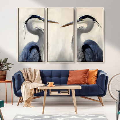 Two blue herons facing each other on a soft neutral background, ideal for coastal, tranquil, or nature-inspired minimalist interiors.