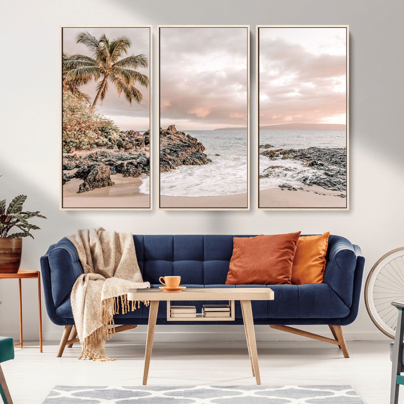 A peaceful beach scene with a palm tree and rocks, soft waves washing onto the shore under a soft pastel sky at sunset.