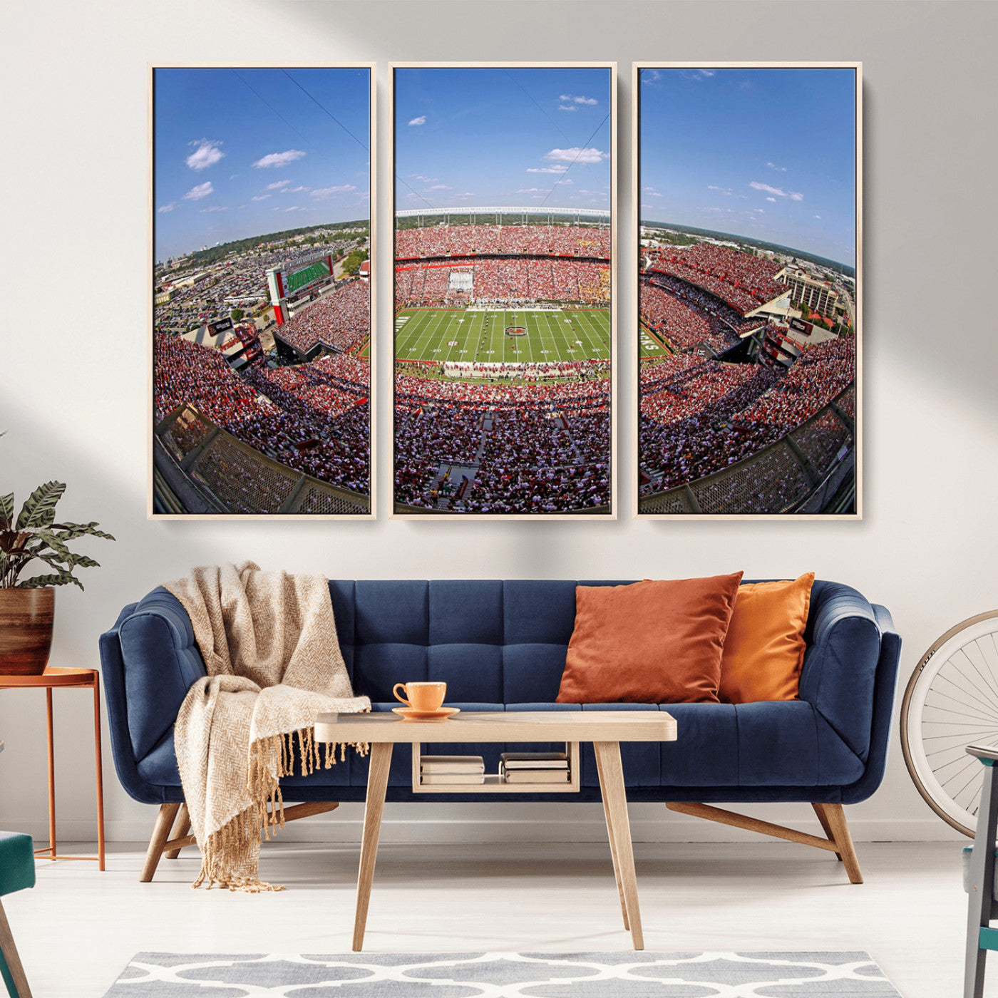 An William Brice-Stadium view of a full football stadium with cheering fans and clear blue skies, capturing the excitement and energy of the game.