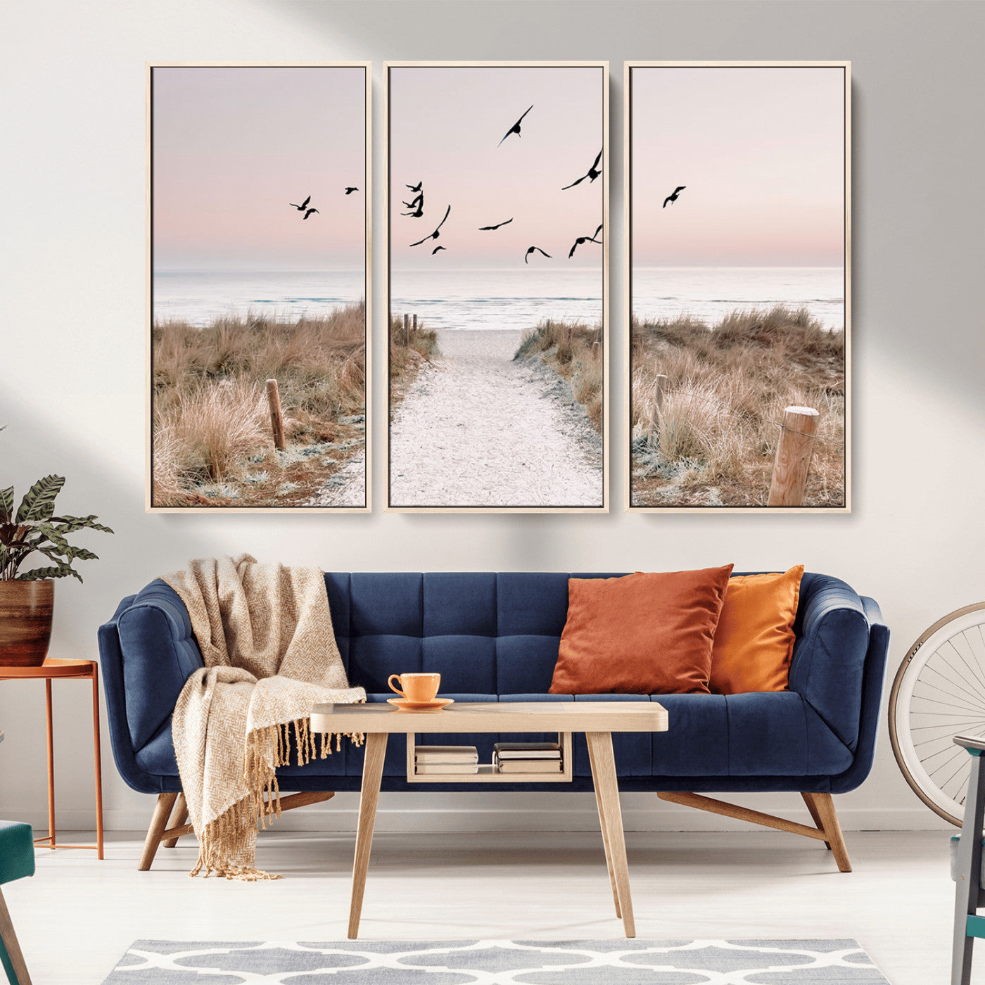 A peaceful coastal pathway leading to the ocean, with birds flying across a soft pastel sky, creating a calm and scenic beach atmosphere.