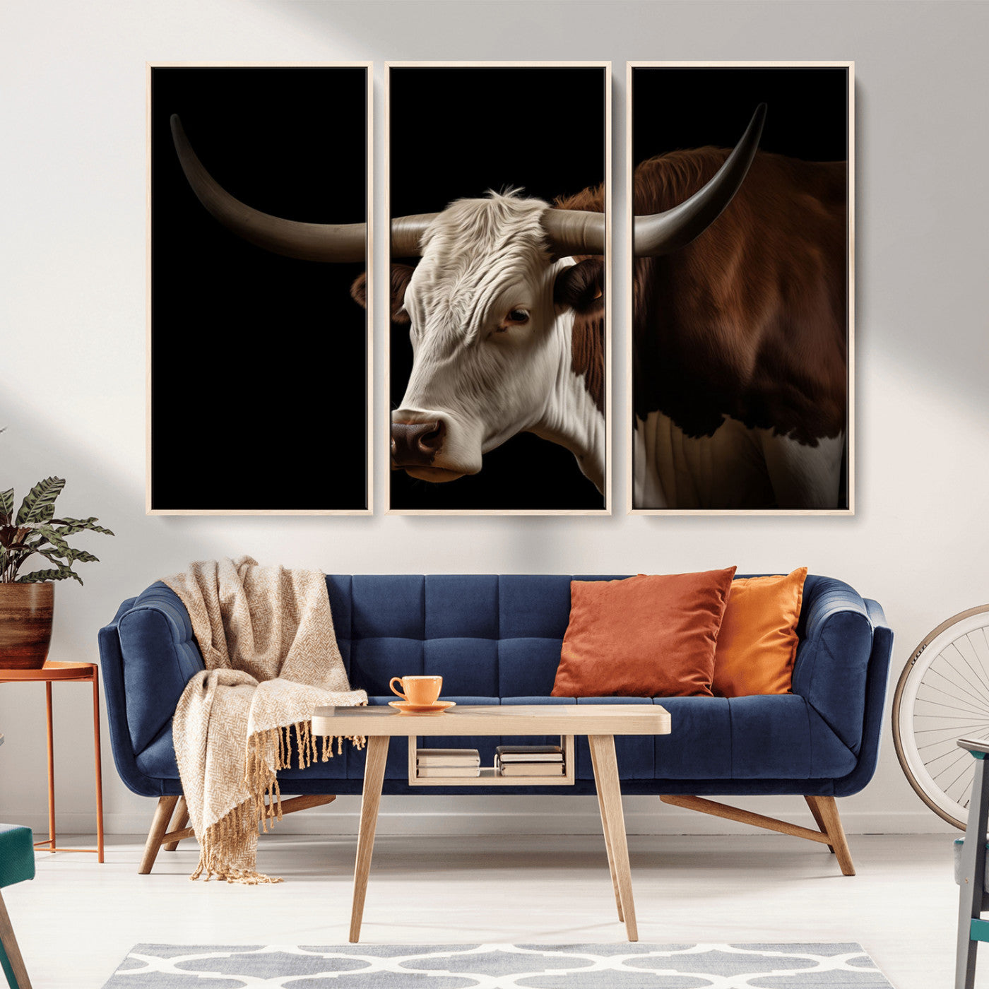 "Close-up of a brown and white longhorn cow with prominent curved horns against a black background."