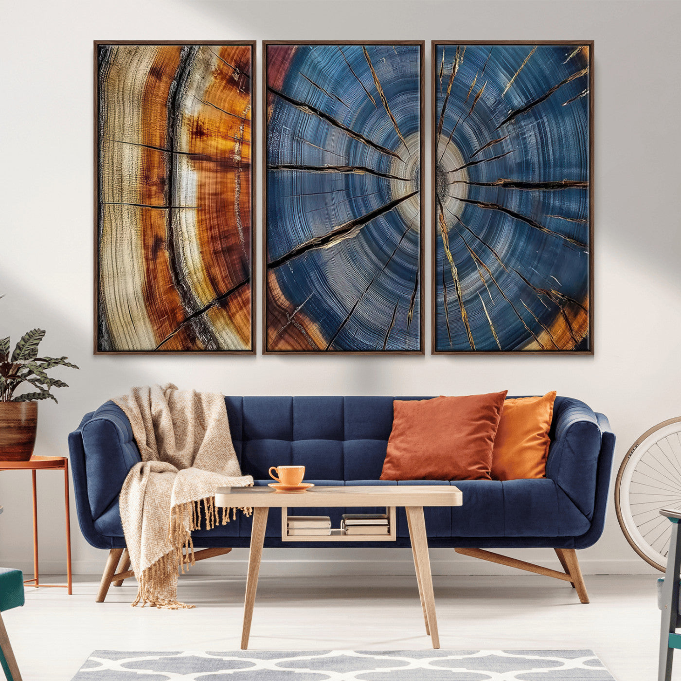 A stunning close-up view of a tree trunk, showcasing the intricate growth rings in a vibrant mix of warm browns, cool blues, and hints of natural texture.