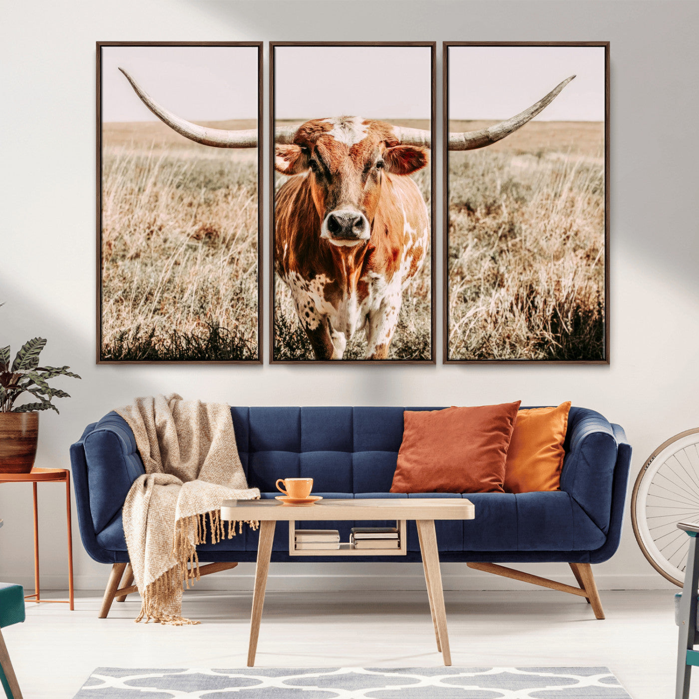 Framed longhorn cow canvas wall art with rustic prairie background, western animal print perfect for farmhouse or ranch style decor