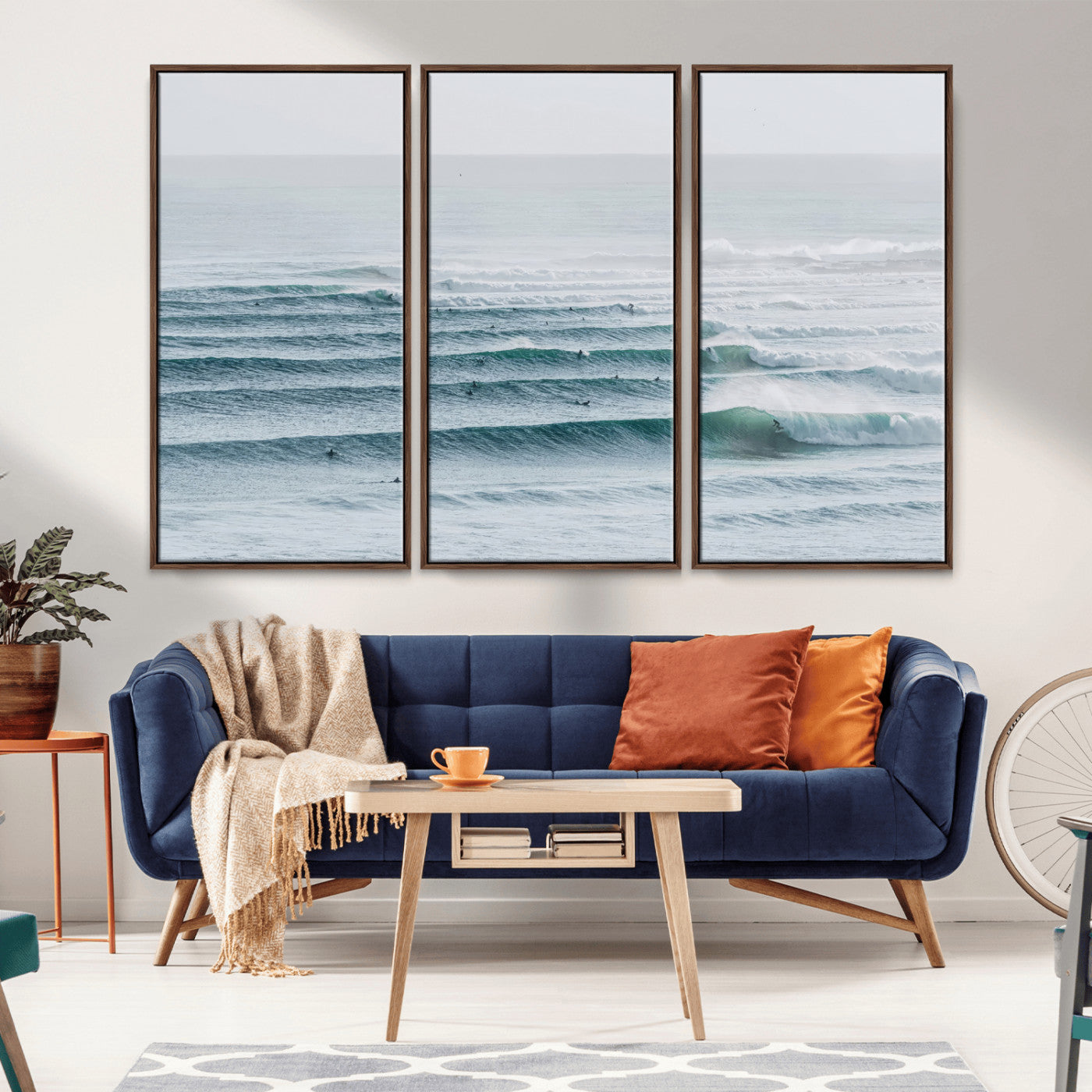 High-angle view of surfers lining up across layered ocean waves, ideal for minimal coastal or surf-inspired room decor.