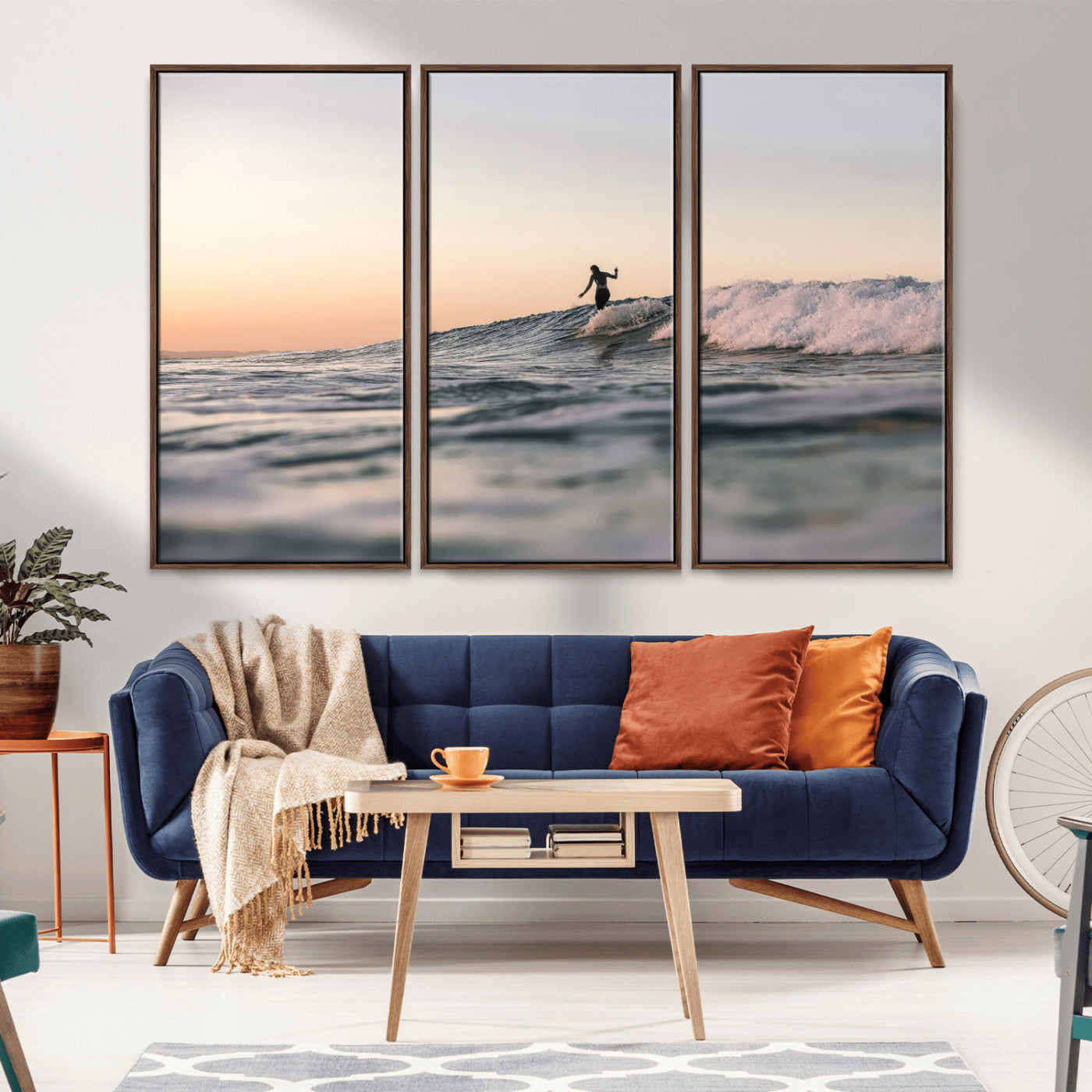 Framed canvas of a female surfer balancing on a wave at sunset, perfect for serene surf or ocean-inspired coastal decor.