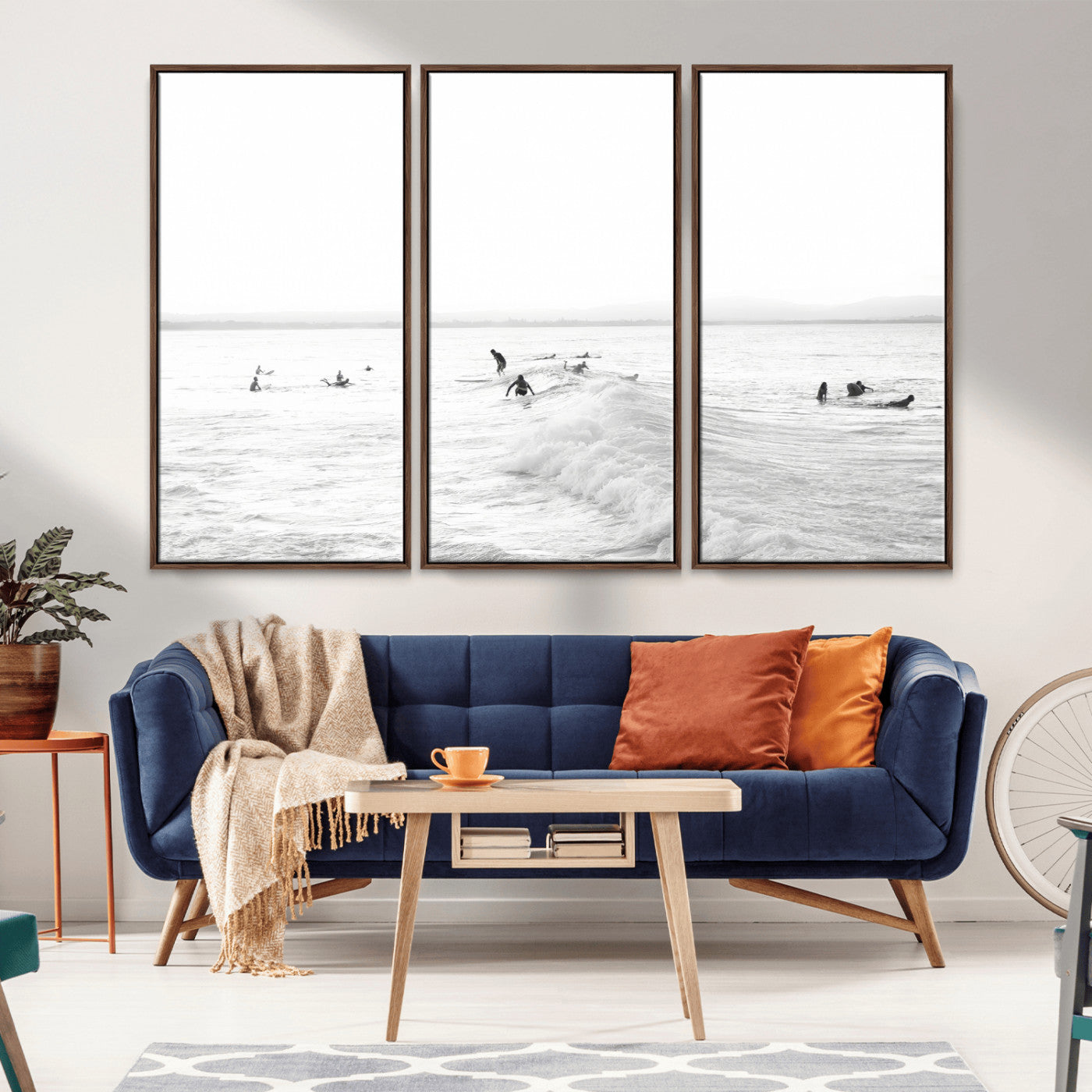 Monochrome photo of surfers riding and waiting on ocean waves, ideal for surf-themed or coastal energy wall decor.