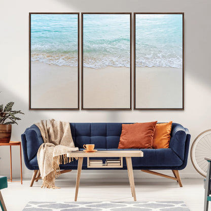 Soft shoreline with gentle aqua waves on smooth sand, ideal for minimalist coastal or pastel ocean-inspired home wall decor.