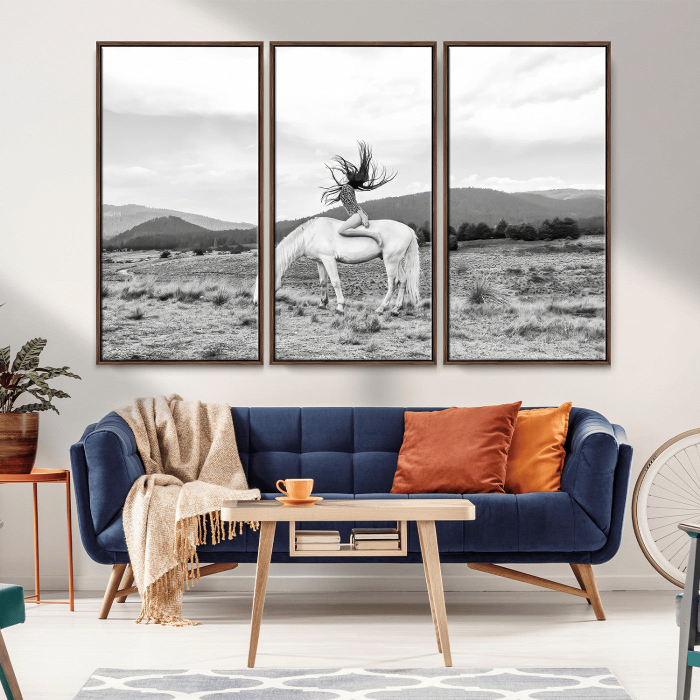 Black and white photo of a woman on a white horse in moody tones, ideal for Western Boho or modern rustic-style home decor.