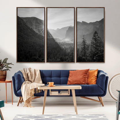 Black and white landscape of Yosemite with sun rays peeking over El Capitan, ideal for moody nature or modern rustic decor.