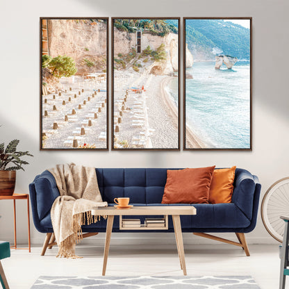 Wall art of a calm Mediterranean beach with rows of sun loungers and umbrellas in soft pastel tones, perfect for light coastal or vacation-themed decor.