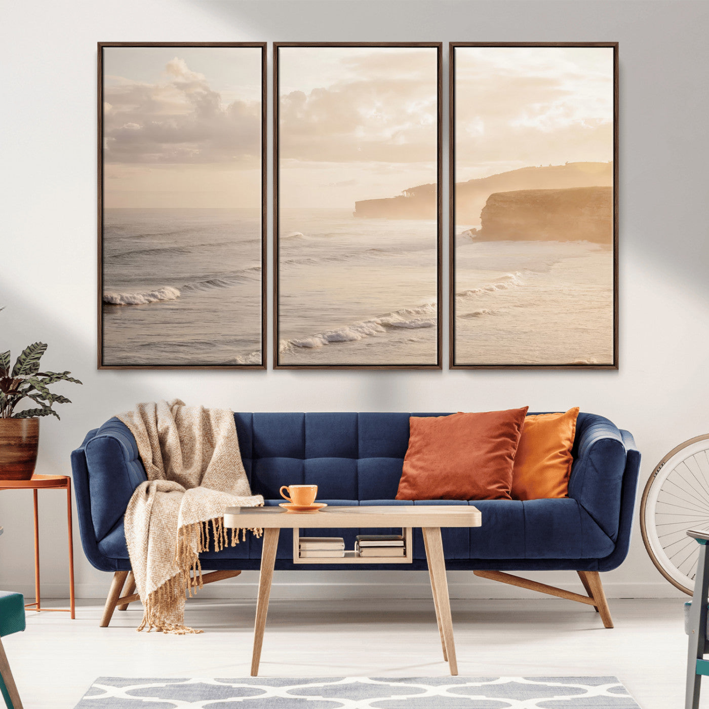 Golden hour seascape with misty cliffs and gentle waves rolling towards the shore, capturing a tranquil and warm coastal atmosphere.