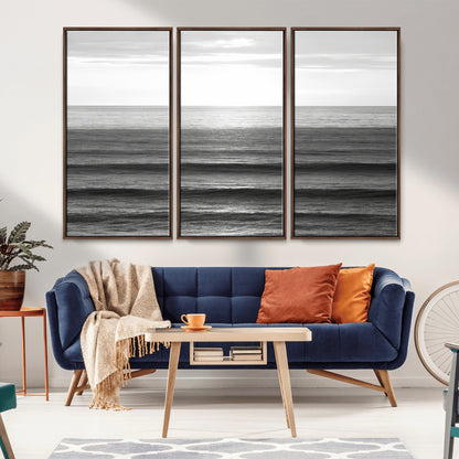 Minimalist black and white ocean view with layered waves reflecting sunlight, evoking a sense of calm and coastal serenity.