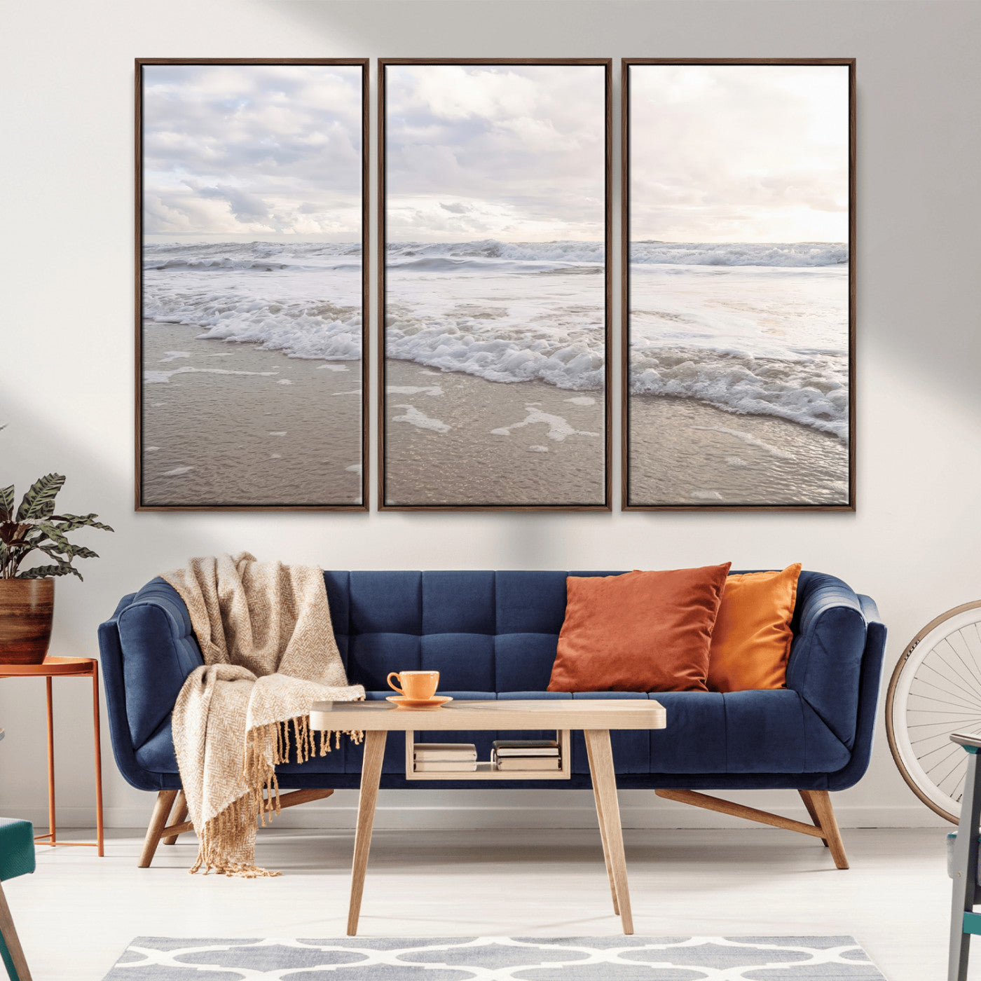 Peaceful ocean waves rolling onto the sandy shore under soft light, perfect for neutral or coastal minimalist decor themes.