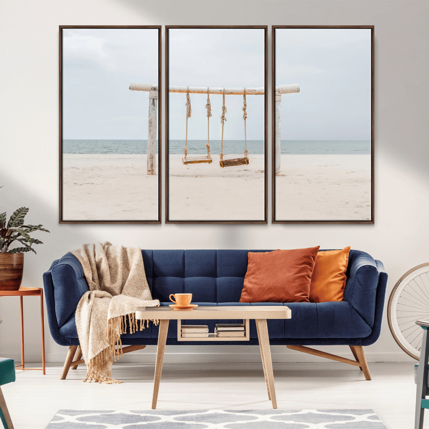 A rustic wooden beach swing stands on a serene sandy shore with an ocean horizon in the background, creating a tranquil and dreamy coastal escape.