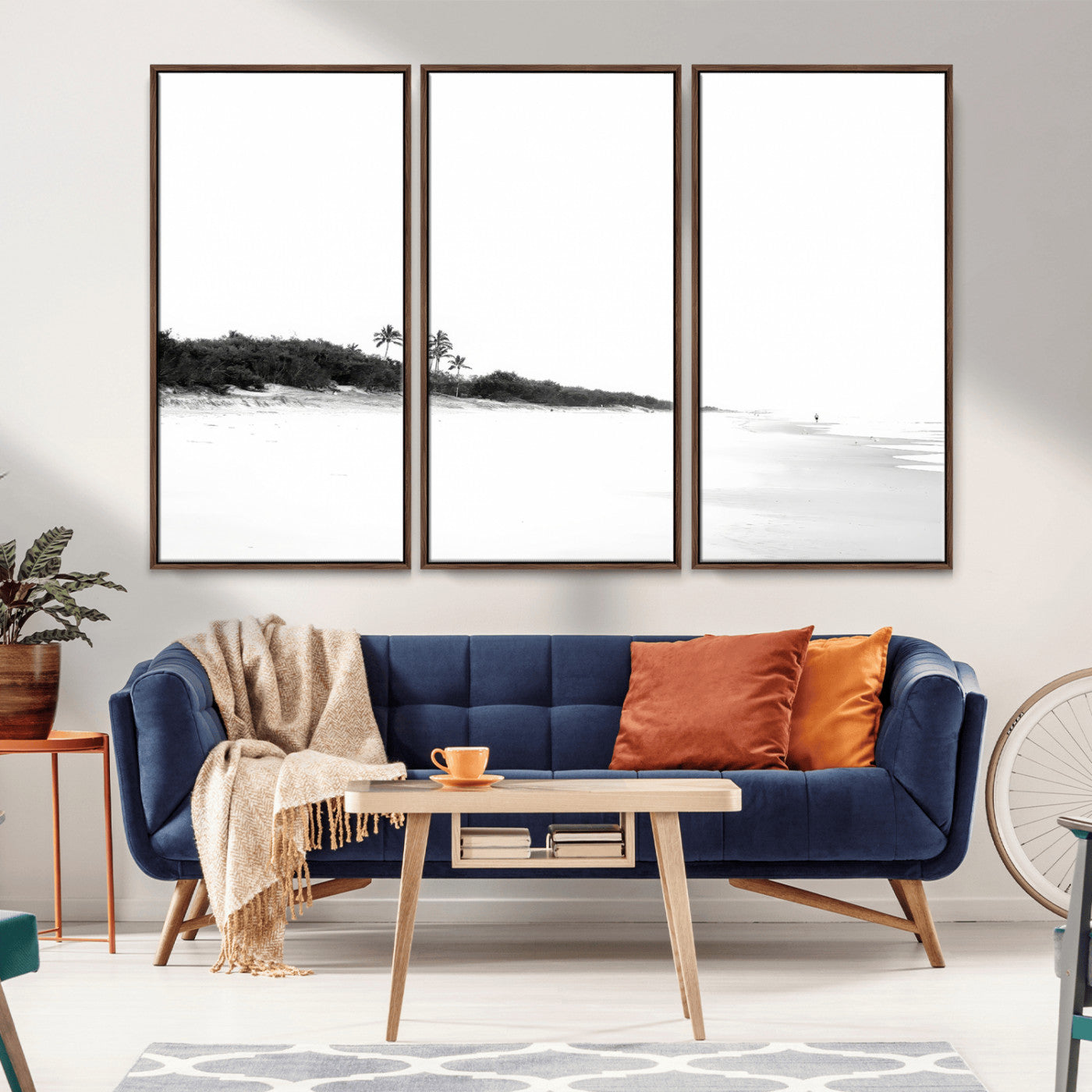 A black and white minimalist coastal scene with a vast open beach, distant palm trees, and a lone figure walking along the shoreline, evoking serenity and solitude.
