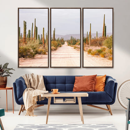 A desert road lined with saguaro cacti under a golden sky, creating a warm southwestern feel, perfect for boho or rustic decor.