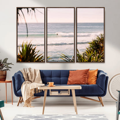 Canvas of a lone surfer riding a pastel wave at sunrise, perfect for tropical or coastal-themed spaces with a relaxed, airy vibe.