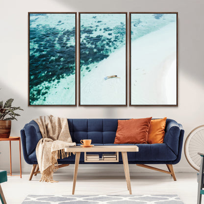 Canvas featuring an aerial view of a swimmer in shallow turquoise waters with coral patterns, ideal for tropical coastal home decor.