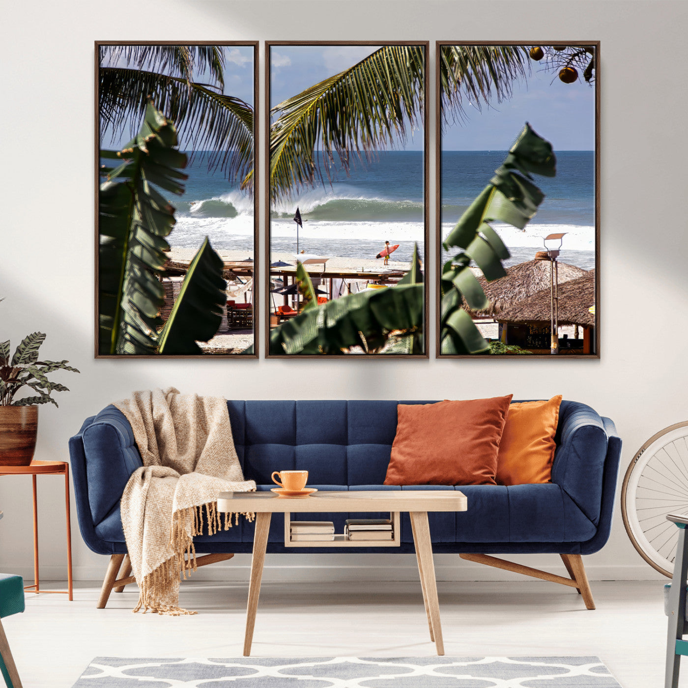 Canvas wall art of a tropical surf scene framed by palm trees, with a surfer on the shore and waves rolling in, ideal for beach-themed decor.