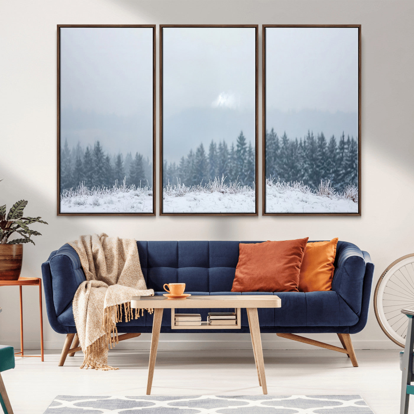 Snow-covered forest under misty sky, soft light breaking through clouds, ideal for minimalist or Nordic-inspired home decor.