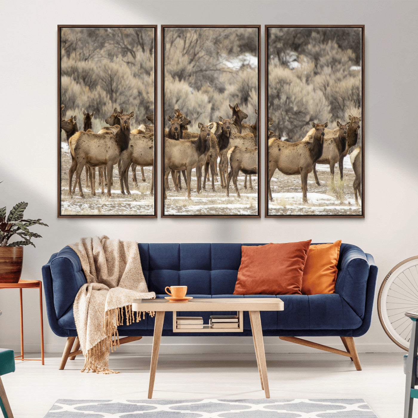 A large herd of elk standing in an open field with soft earthy tones, ideal for rustic lodge or western-themed home wall decor.