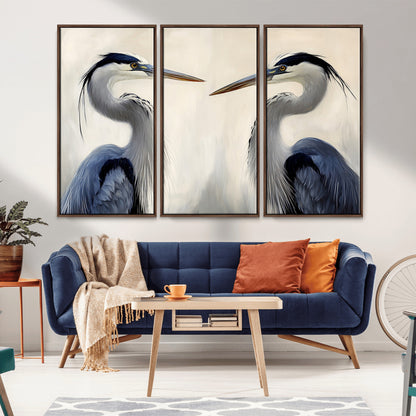 Two blue herons facing each other on a soft neutral background, ideal for coastal, tranquil, or nature-inspired minimalist interiors.
