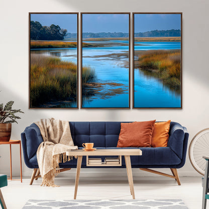 A peaceful marshland scene with calm blue water reflecting the surrounding grasses and trees, capturing the beauty of nature in a serene landscape.