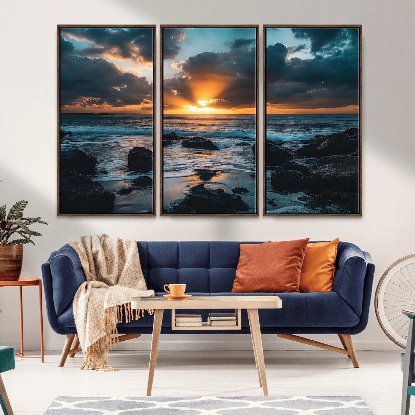 An awe-inspiring sunset over the ocean with rays of light piercing through dramatic clouds, creating a beautiful seascape with rocks in the foreground.