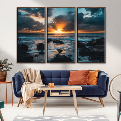 An awe-inspiring sunset over the ocean with rays of light piercing through dramatic clouds, creating a beautiful seascape with rocks in the foreground.