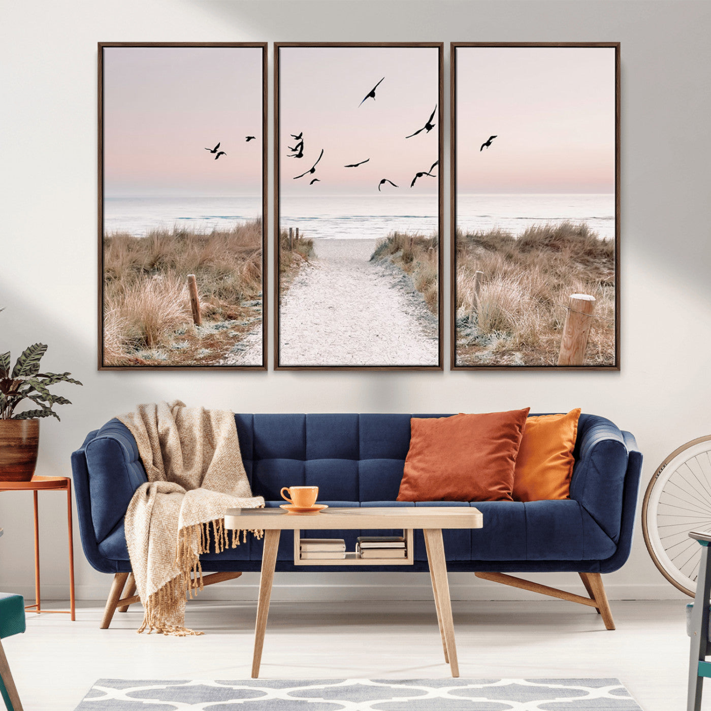 A peaceful coastal pathway leading to the ocean, with birds flying across a soft pastel sky, creating a calm and scenic beach atmosphere.