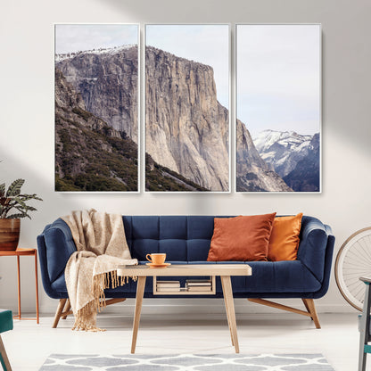 Framed canvas of El Capitan’s vertical granite face in Yosemite with snowy peaks, ideal for Sierra minimalism or mountain-inspired decor.