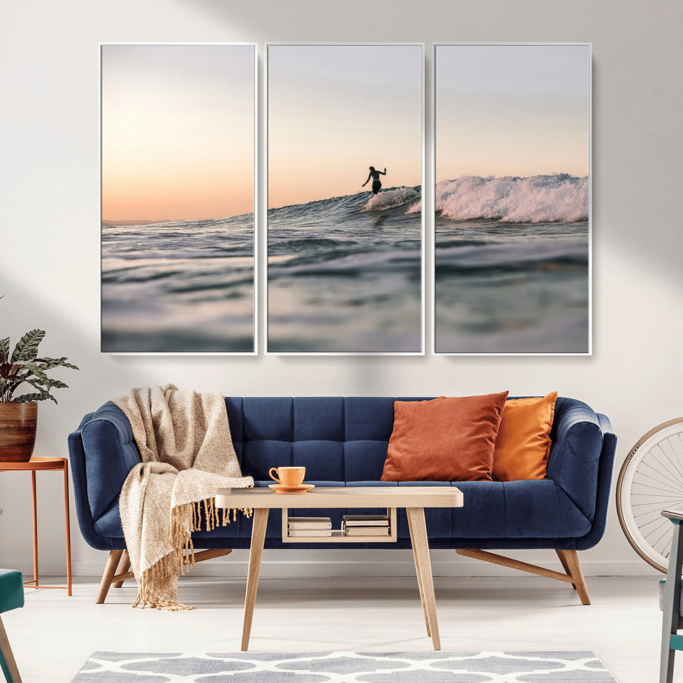 Framed canvas of a female surfer balancing on a wave at sunset, perfect for serene surf or ocean-inspired coastal decor.