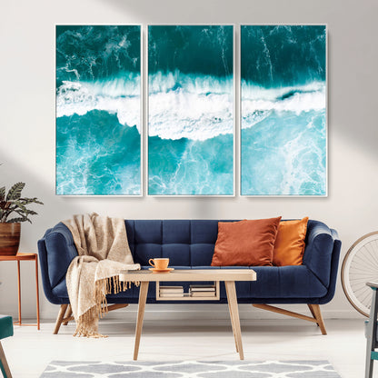 Aerial view of turquoise ocean waves crashing with white foam, perfect for tropical coastal or modern beach-style home decor.