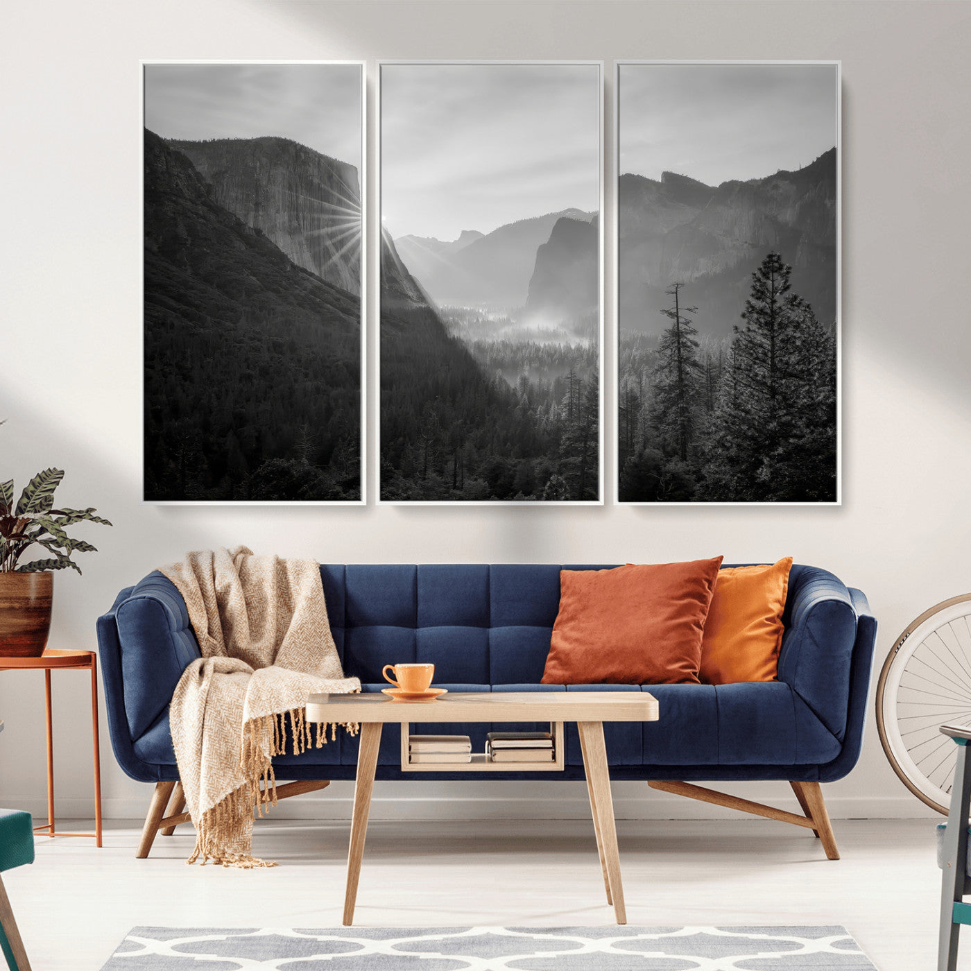 Black and white landscape of Yosemite with sun rays peeking over El Capitan, ideal for moody nature or modern rustic decor.
