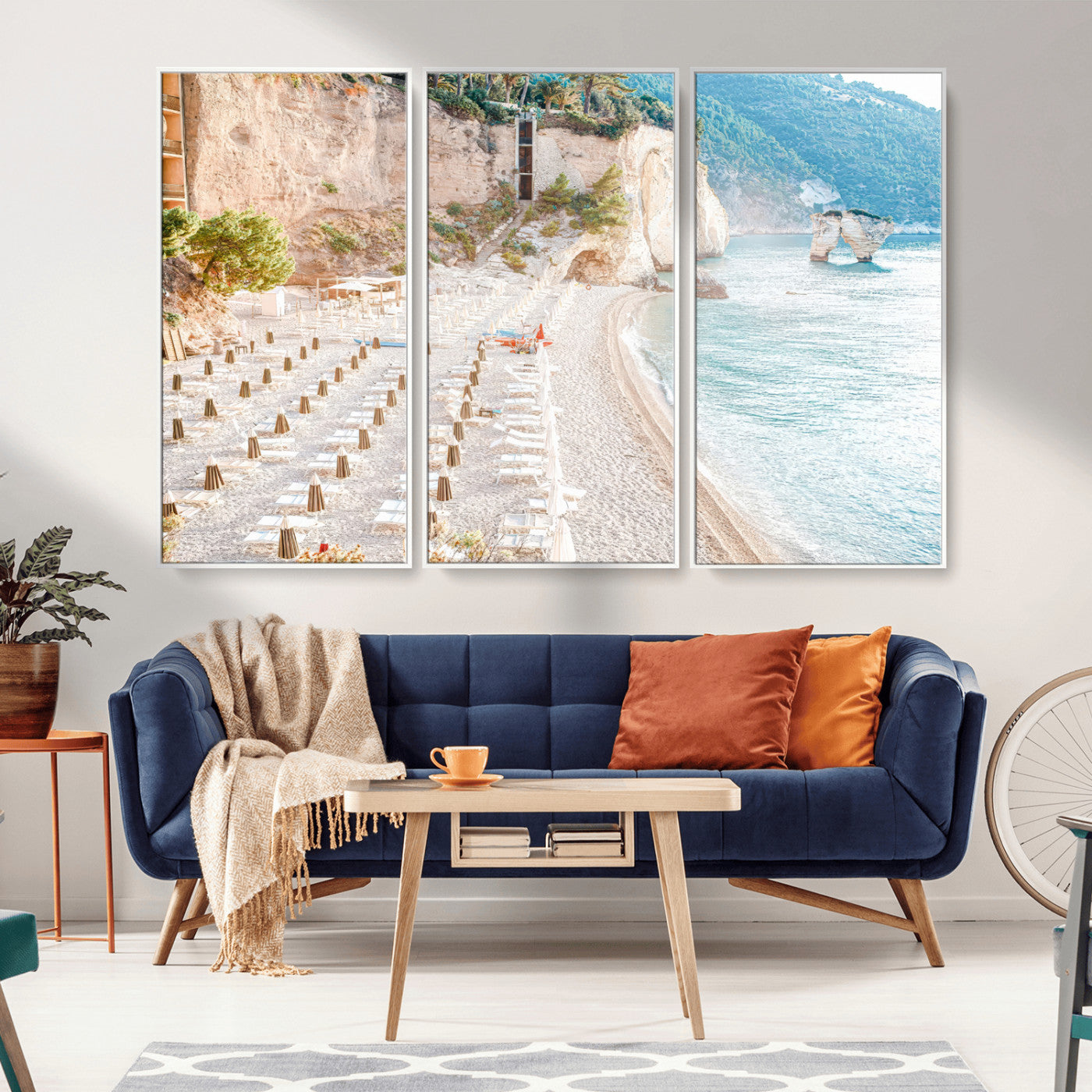 Wall art of a calm Mediterranean beach with rows of sun loungers and umbrellas in soft pastel tones, perfect for light coastal or vacation-themed decor.